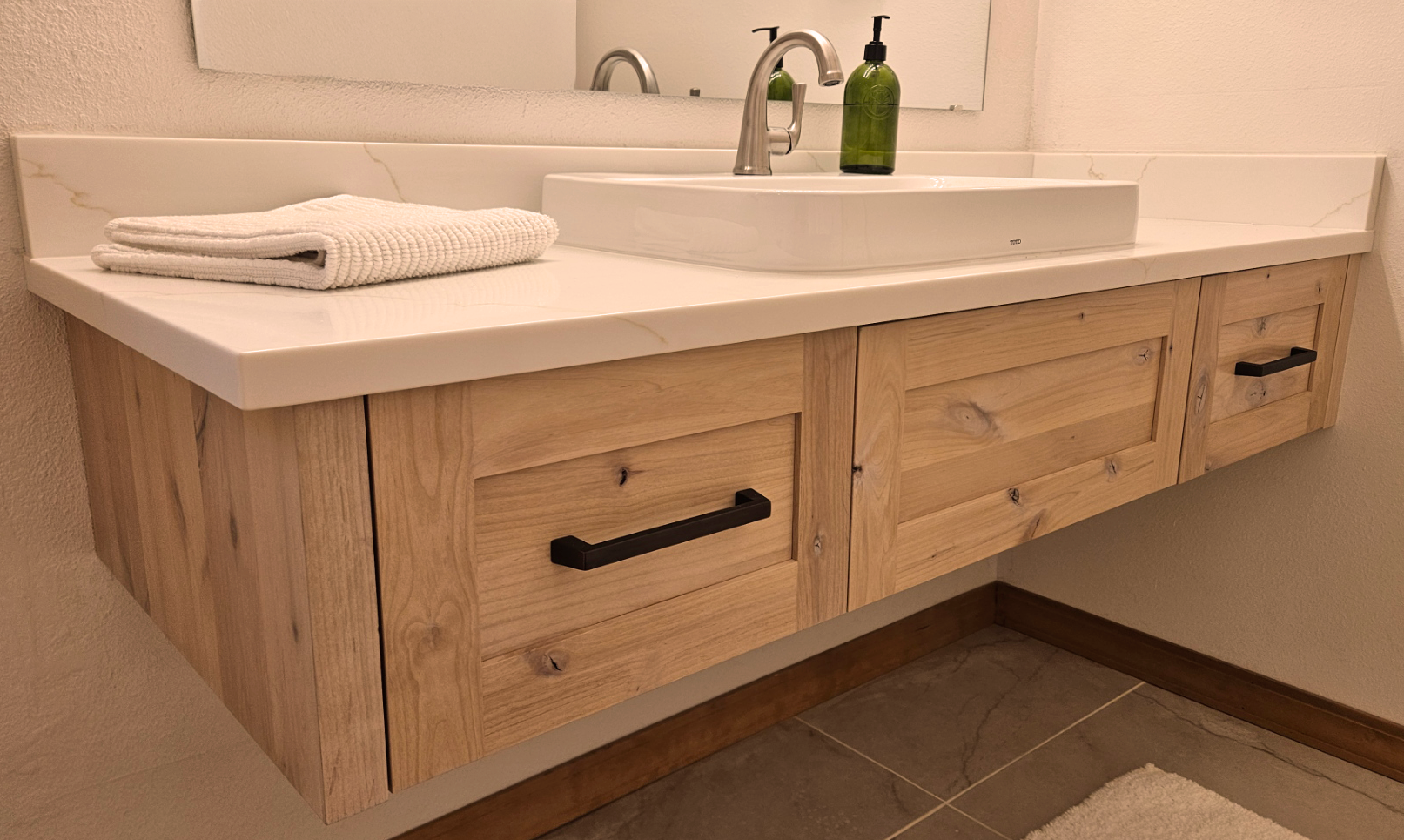 After photo of custom floating bathroom vanity and mirror